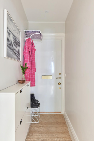 Маленькая угловая квартира в интересных оттенках зелёного в Стокгольме (50 кв. м)