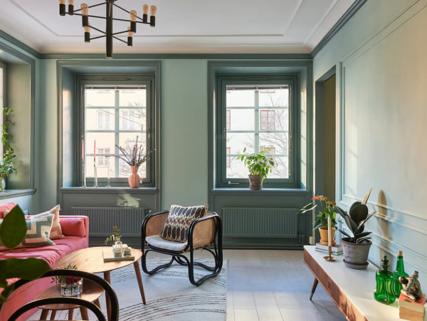 Маленькая угловая квартира в интересных оттенках зелёного в Стокгольме (50 кв. м)